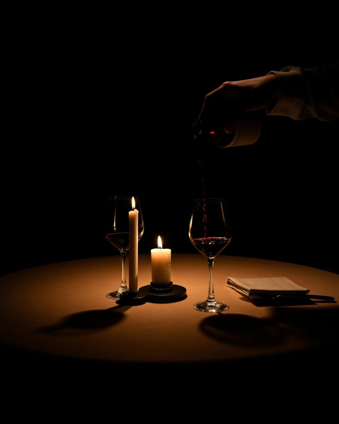 A table set for dinner, candlelit